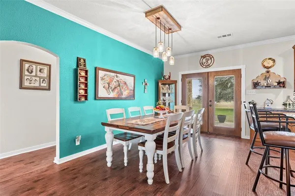 a kitchen with stainless steel appliances granite countertop sink microwave and wooden floor