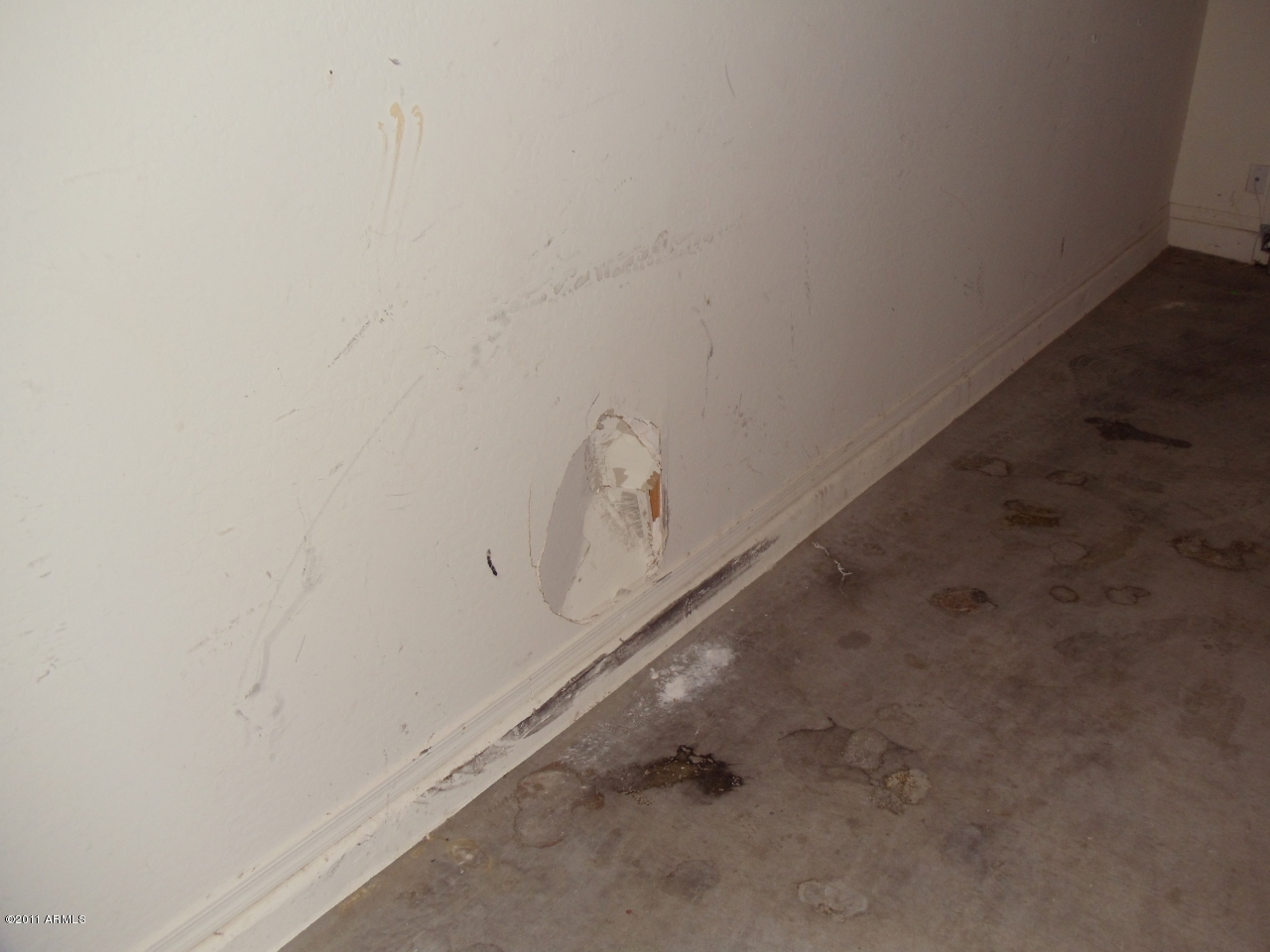 8511 West Payson Road Tolleson, AZ 85353 - Photo 26 of 37 GARAGE DRYWALL DAMAGE
