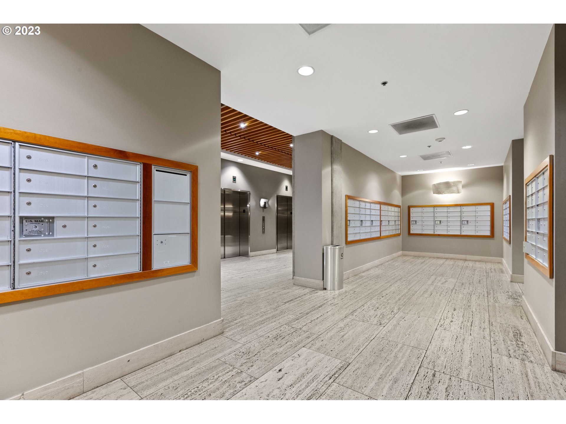 1221 Southwest 10th Avenue, Unit 914 Portland, OR 97205 - Photo 24 of 25 a view of a hallway with wooden floor