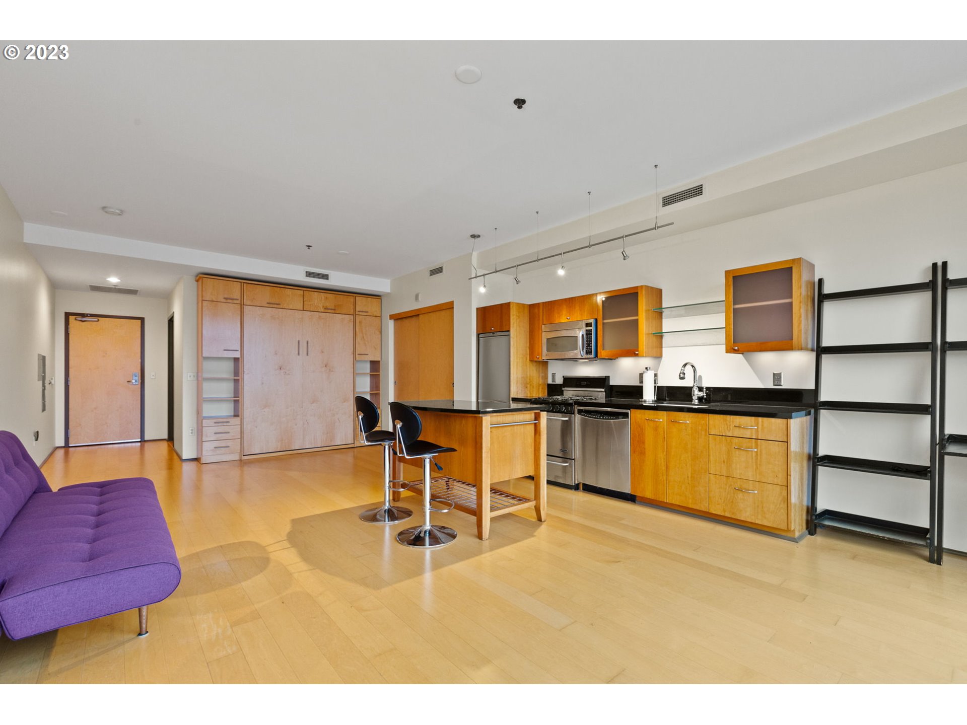 1221 Southwest 10th Avenue, Unit 914 Portland, OR 97205 - Photo 5 of 25 a room with furniture and kitchen view