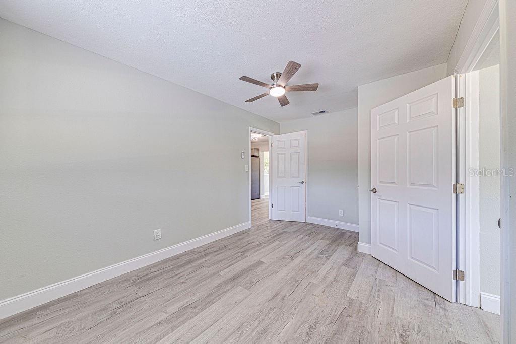 1133 Hermit Smith Road Apopka, FL 32712 - Photo 14 of 34 a view of empty room with wooden floor