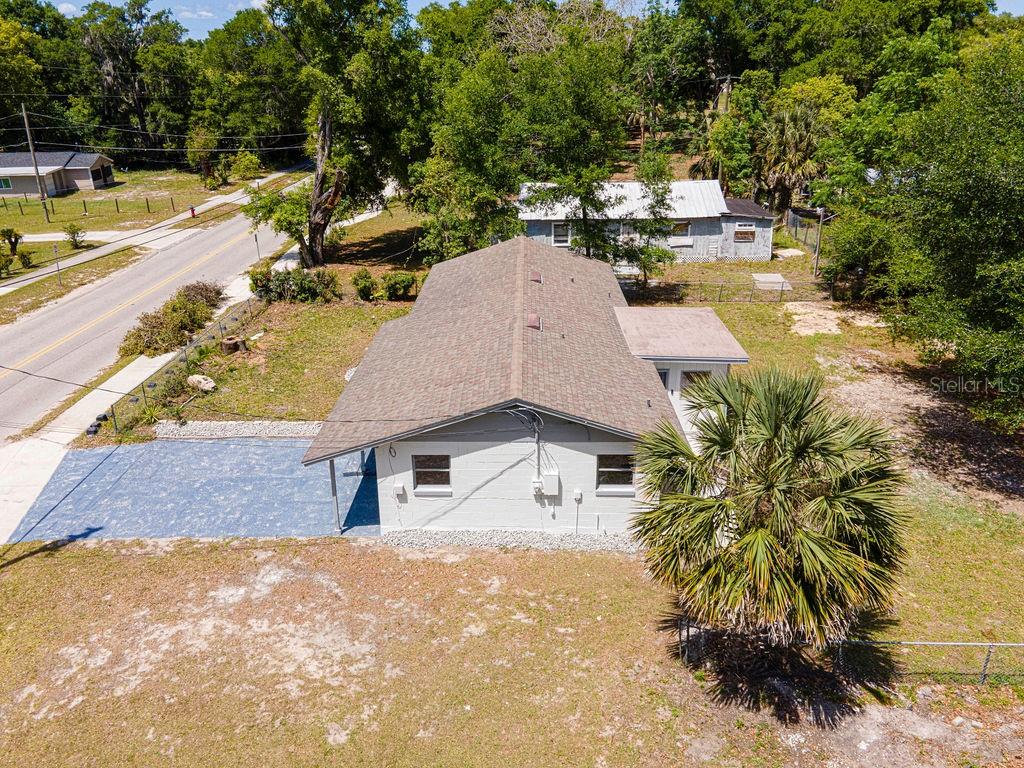 1133 Hermit Smith Road Apopka, FL 32712 - Photo 27 of 34 a view of a house with pool plants and large trees