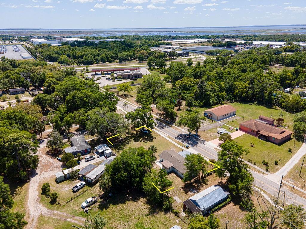 1133 Hermit Smith Road Apopka, FL 32712 - Photo 32 of 34 an aerial view of a house with a yard