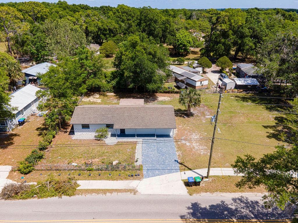 1133 Hermit Smith Road Apopka, FL 32712 - Photo 34 of 34 an aerial view of a house with a yard basket ball court and outdoor seating