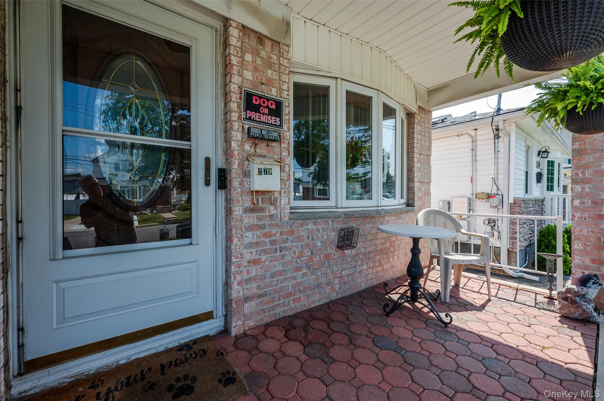 279 Collfield Avenue Staten Island, NY 10314 - Photo 2 of 41 Property entrance featuring brick siding and a porch