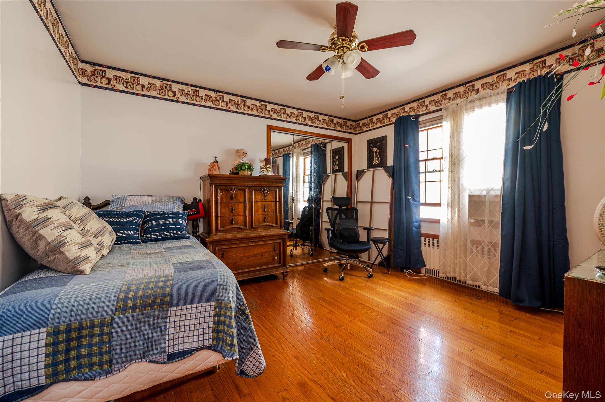 279 Collfield Avenue Staten Island, NY 10314 - Photo 9 of 41 Bedroom with wood-type flooring, a ceiling fan, and a desk