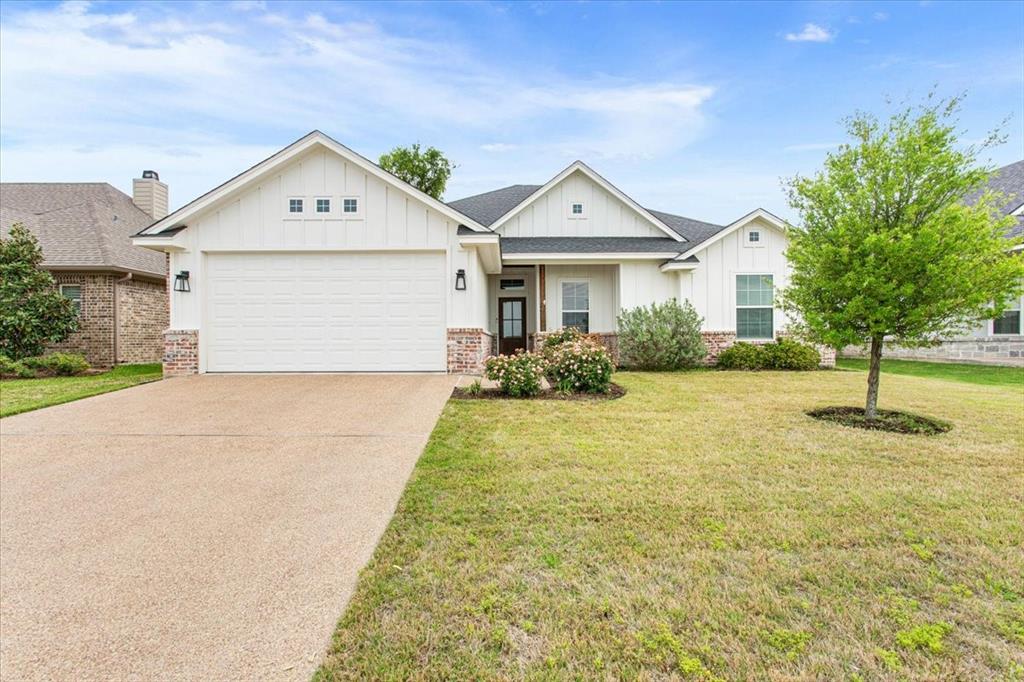 10305 Fallen Leaf Drive Waco, TX 76712 - Photo 1 of 1 a front view of a house with yard and garage