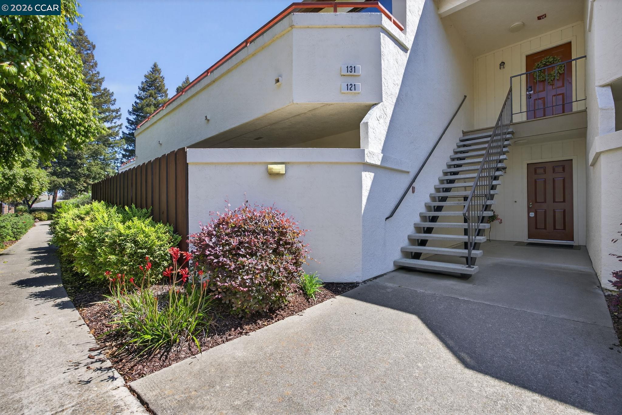 a view of entryway with flower plants