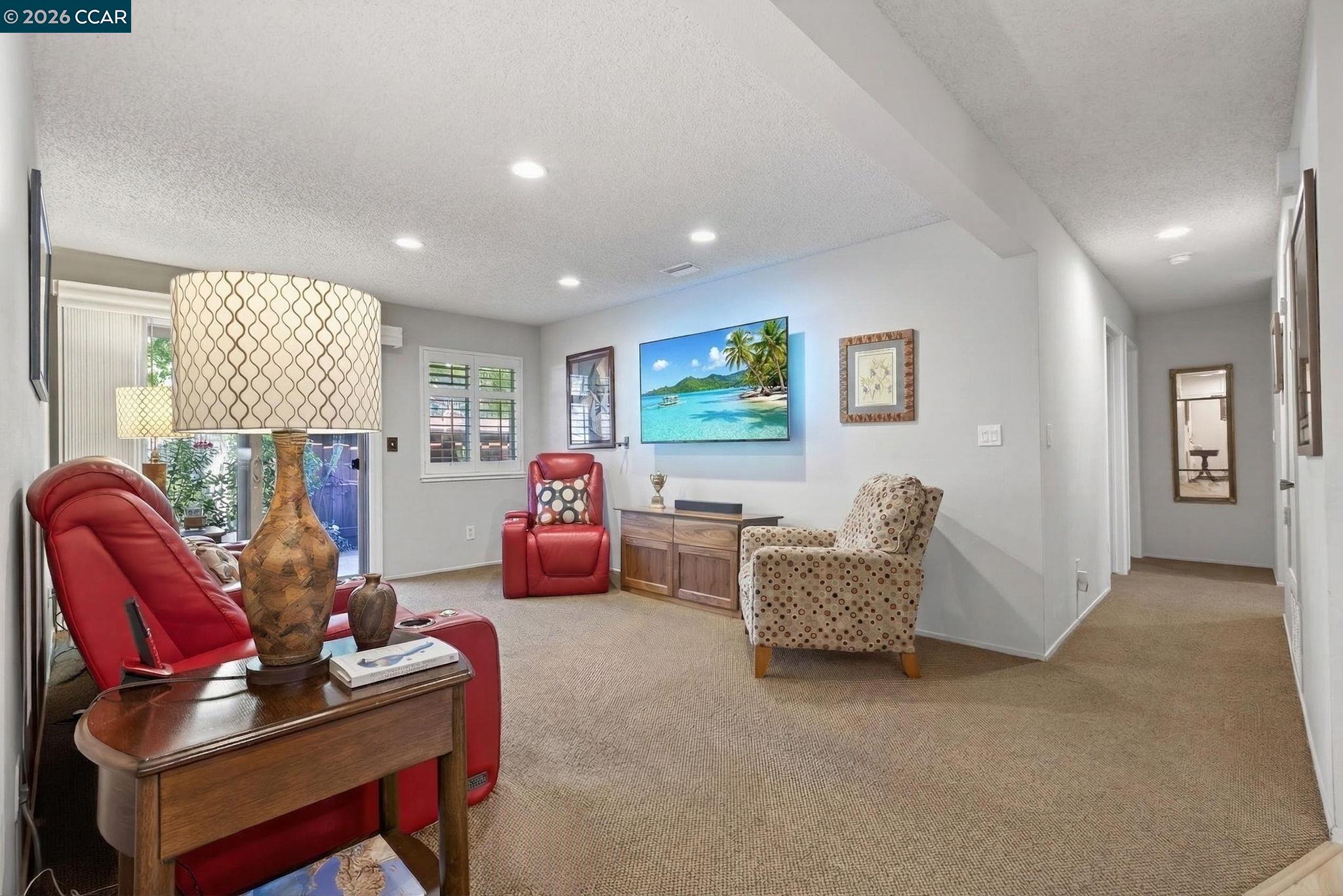 5015 Valley Crest Drive, Unit 121 Concord, CA 94521 - Photo 14 of 30 a living room with furniture and a window
