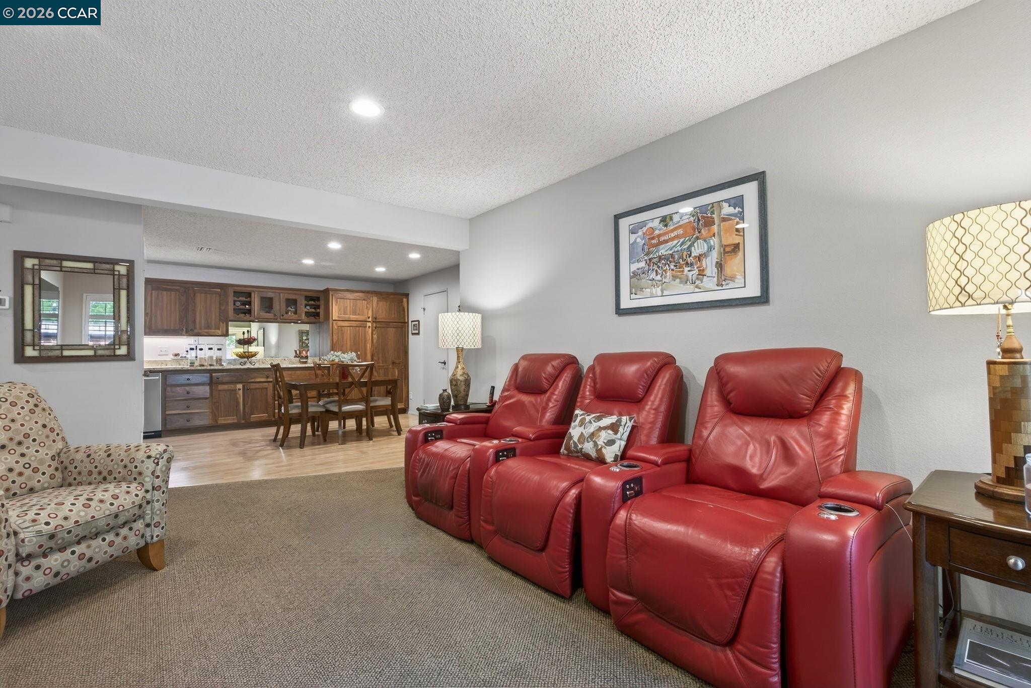 5015 Valley Crest Drive, Unit 121 Concord, CA 94521 - Photo 15 of 30 a living room with furniture and kitchen view