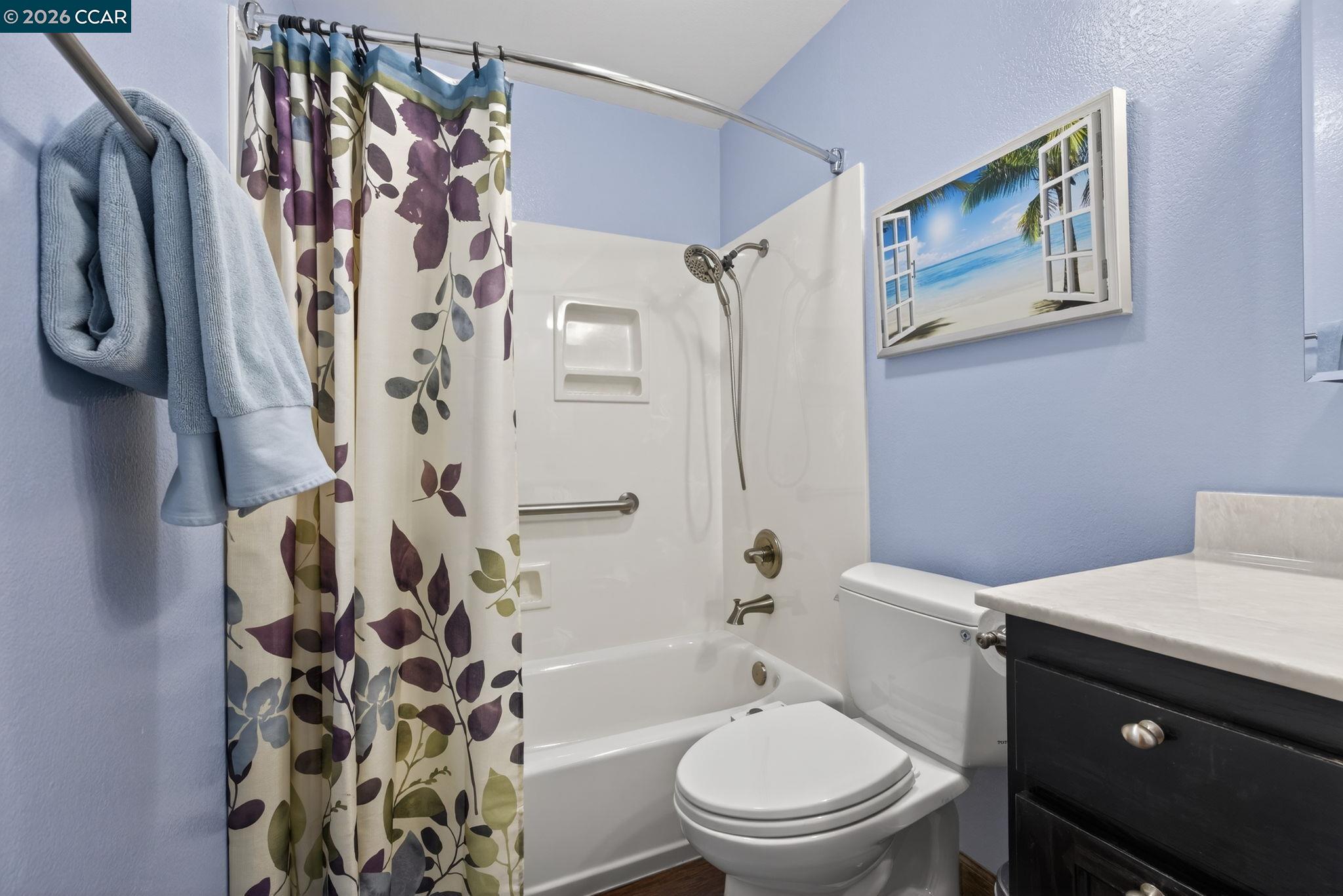5015 Valley Crest Drive, Unit 121 Concord, CA 94521 - Photo 17 of 30 a white toilet sitting next to a bath tub
