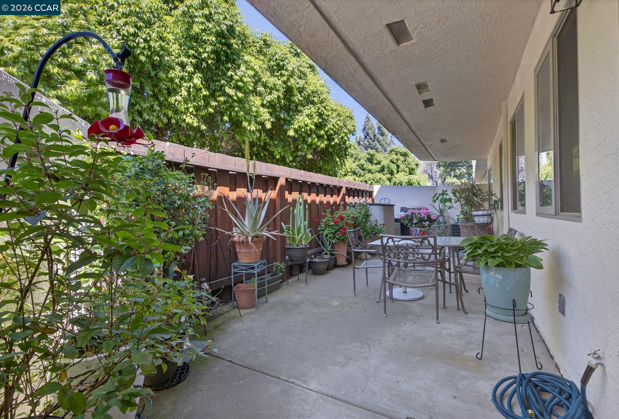 5015 Valley Crest Drive, Unit 121 Concord, CA 94521 - Photo 24 of 30 a view of a chairs and table in a patio