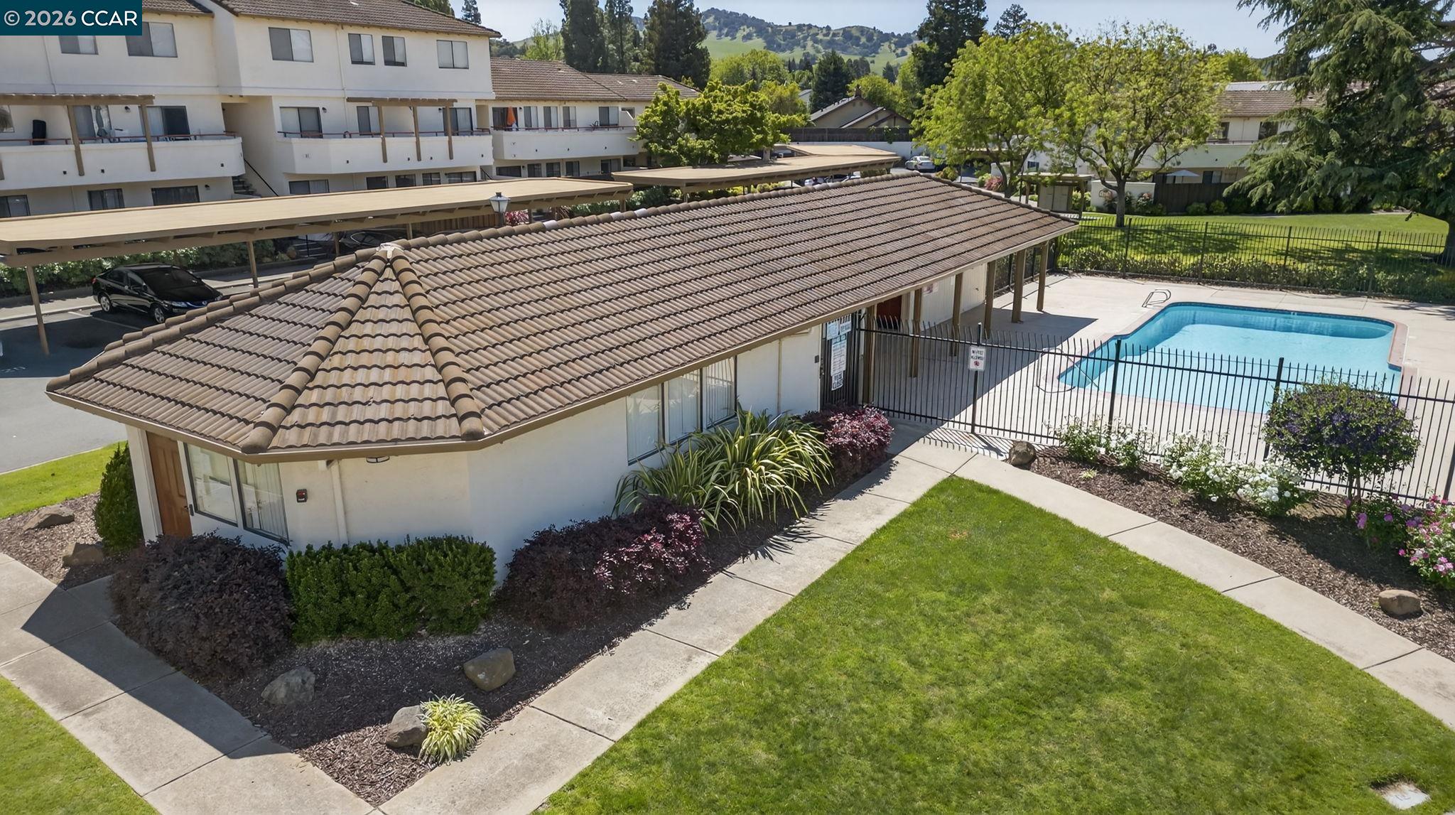 5015 Valley Crest Drive, Unit 121 Concord, CA 94521 - Photo 27 of 30 a view of a house with backyard and sitting area