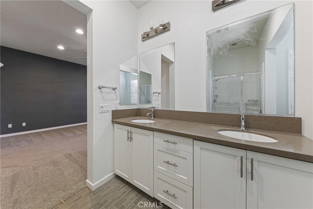282 Borrego Irvine, CA 92618 - Photo 11 of 24 a bathroom with a granite countertop sink and a mirror