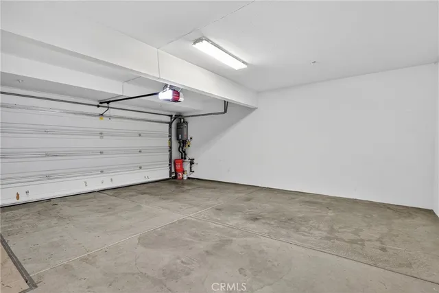 a view of a chair and tables in the patio