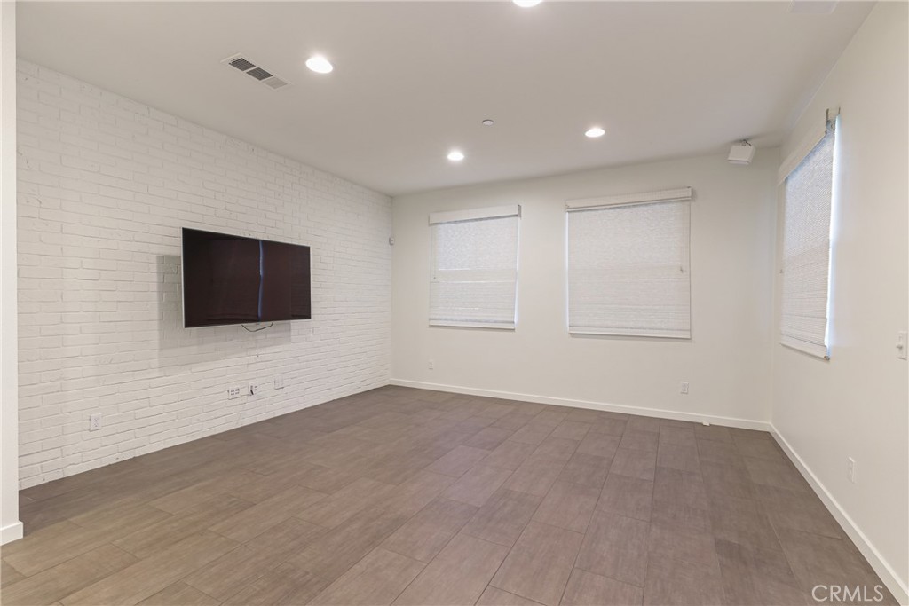 282 Borrego Irvine, CA 92618 - Photo 7 of 24 an empty room with wooden floor and windows