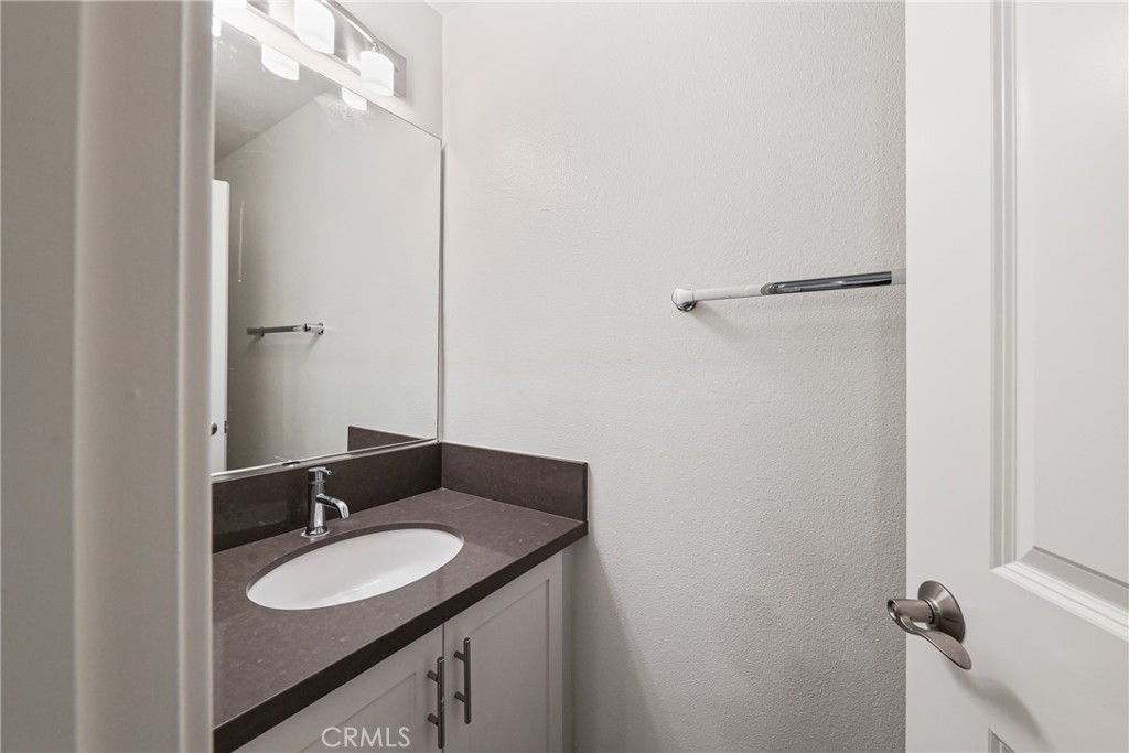 282 Borrego Irvine, CA 92618 - Photo 8 of 24 a bathroom with a granite countertop sink and a mirror