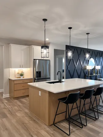 a kitchen with a table chairs refrigerator and sink
