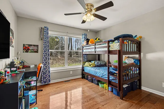 a bed room with furniture and a window