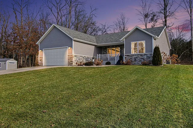 a view of a house with a yard