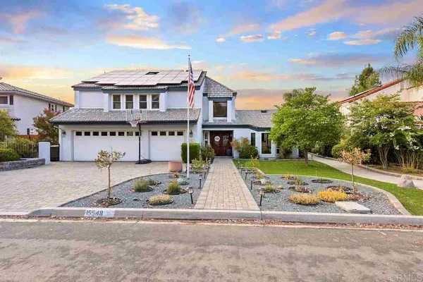 a view of house with yard in front of it