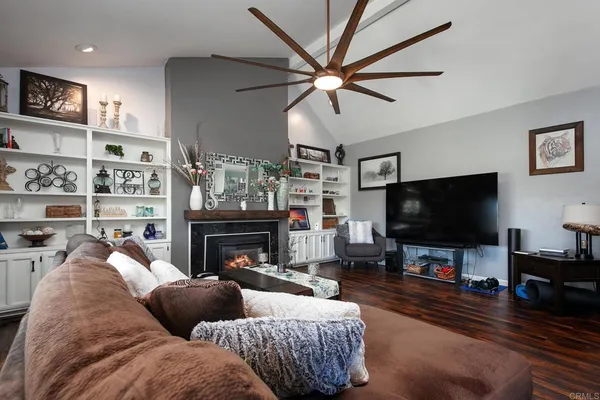 a view of a dining room with furniture large windows and wooden floor