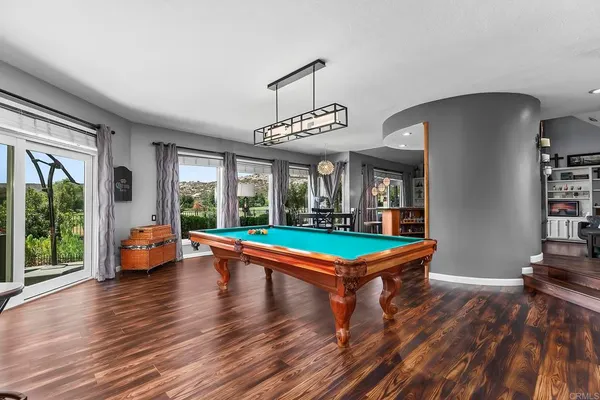 a living room with furniture ceiling fan and a window