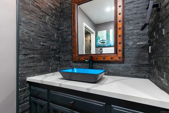 a swimming pool with outdoor seating and garden