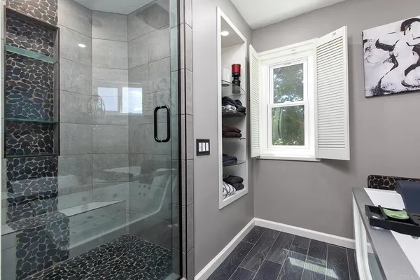 a view of a patio with couches table and chairs and potted plants
