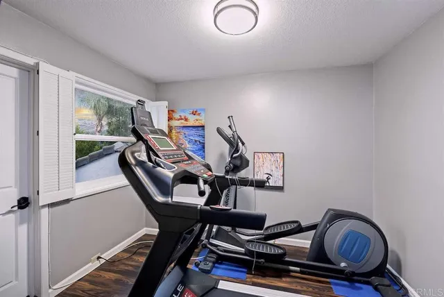 an aerial view of residential houses with outdoor space and river