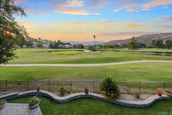 a view of a swimming pool with a table and chairs