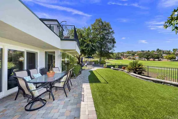 an aerial view of house with yard swimming pool and outdoor seating