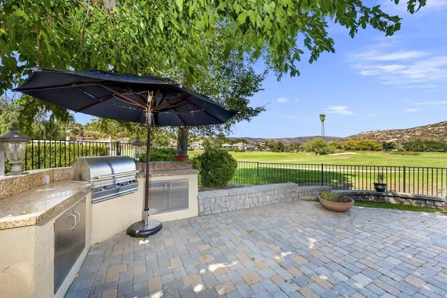 a view of a swimming pool with a patio