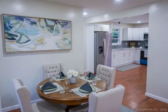 a living room with furniture and kitchen view