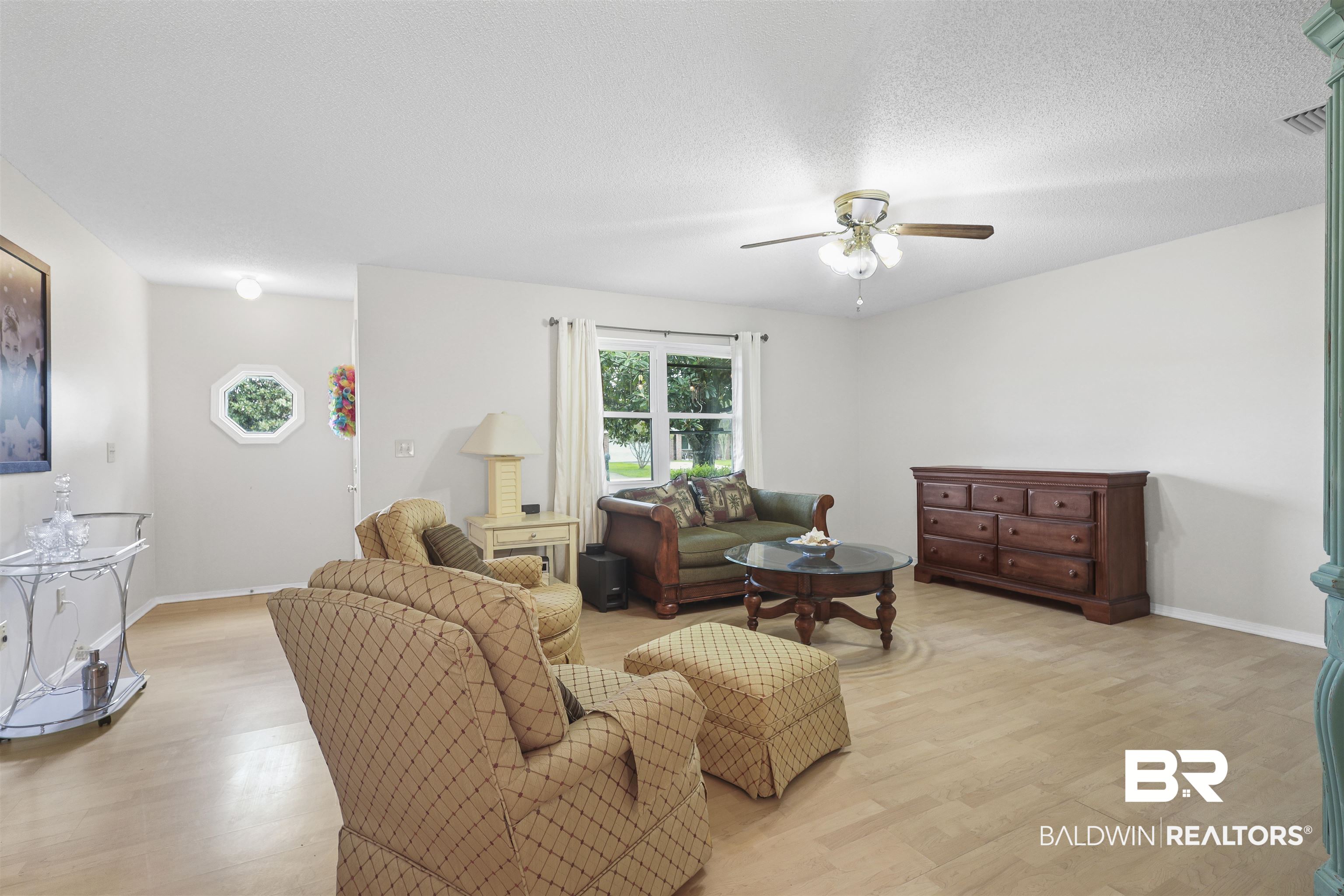 507 West Amanda Avenue Foley, AL 36535 - Photo 5 of 23 Living room featuring light hardwood / wood-style flooring, ceiling fan, and a textured ceiling
