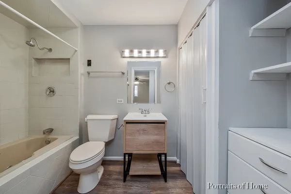 a bathroom with a toilet a sink and a bathtub