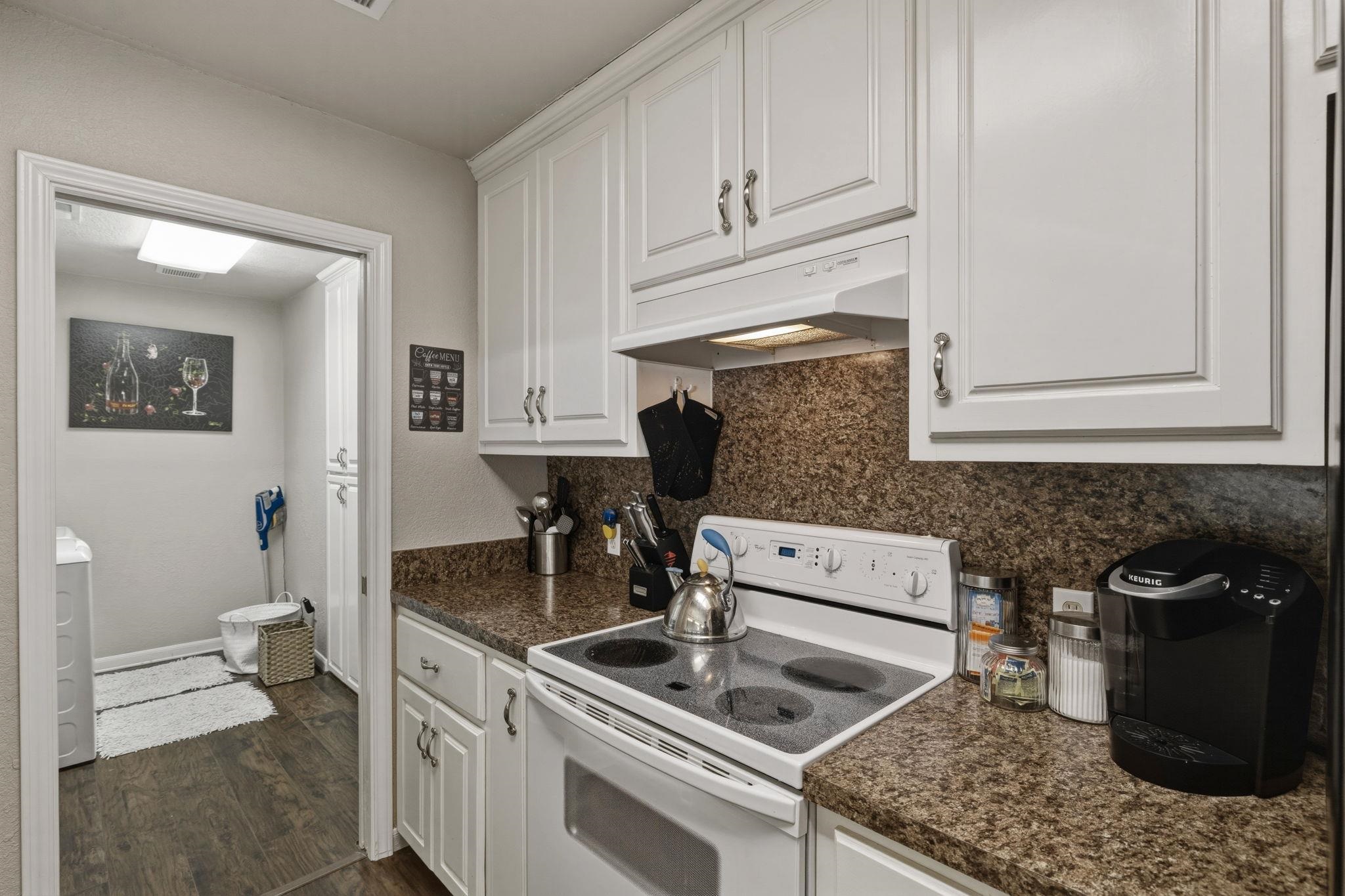 1435 East Zipp Road New Braunfels, TX 78130 - Photo 34 of 43 a kitchen with a sink stove and cabinets