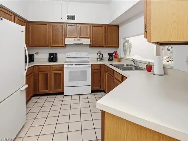 $1,800 | 1833 Courtyard Way, Unit E105, Naples, FL 34112