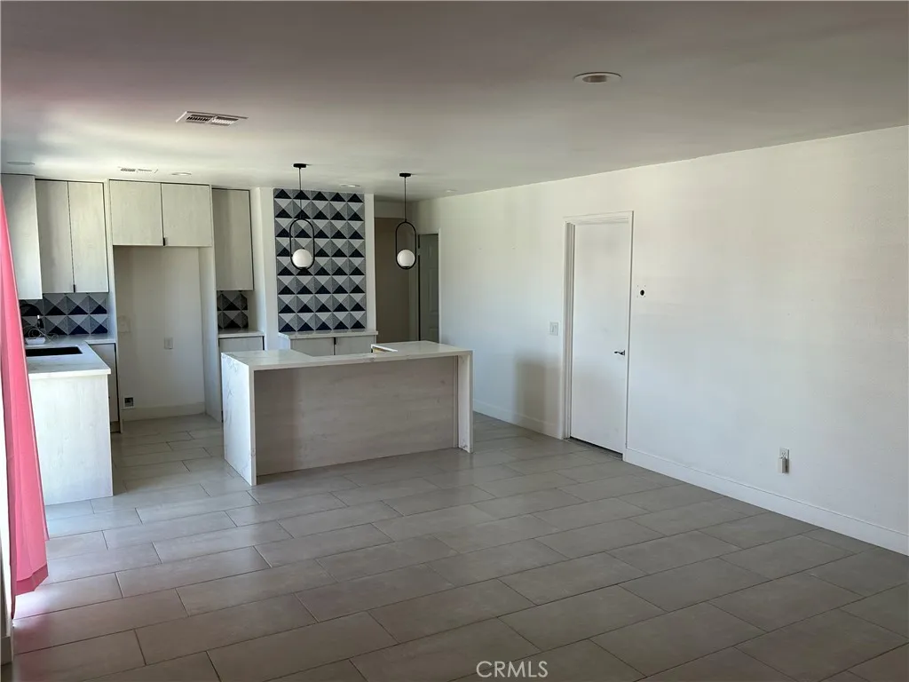 485 West Tramview Road Palm Springs, CA 92262 - Photo 11 of 16 a view of kitchen with refrigerator and window