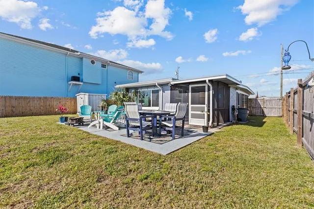 a view of a chairs and table in a patio with a table and chairs