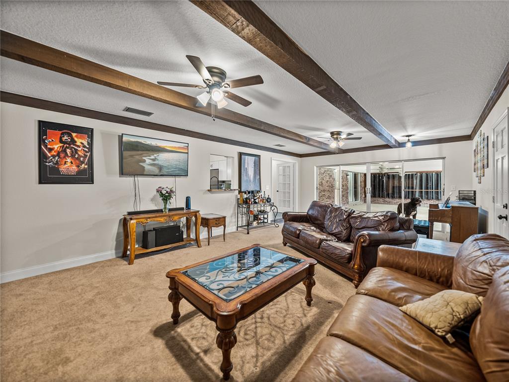 609 West Pipkin Road Lakeland, FL 33813 - Photo 29 of 72 a living room with furniture and a table