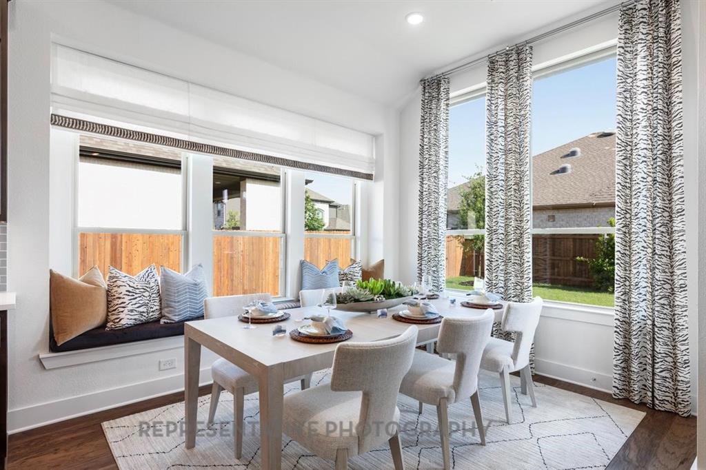1609 Quartz Street Northlake, TX 76247 - Photo 14 of 40 a view of a dining room with furniture and wooden floor
