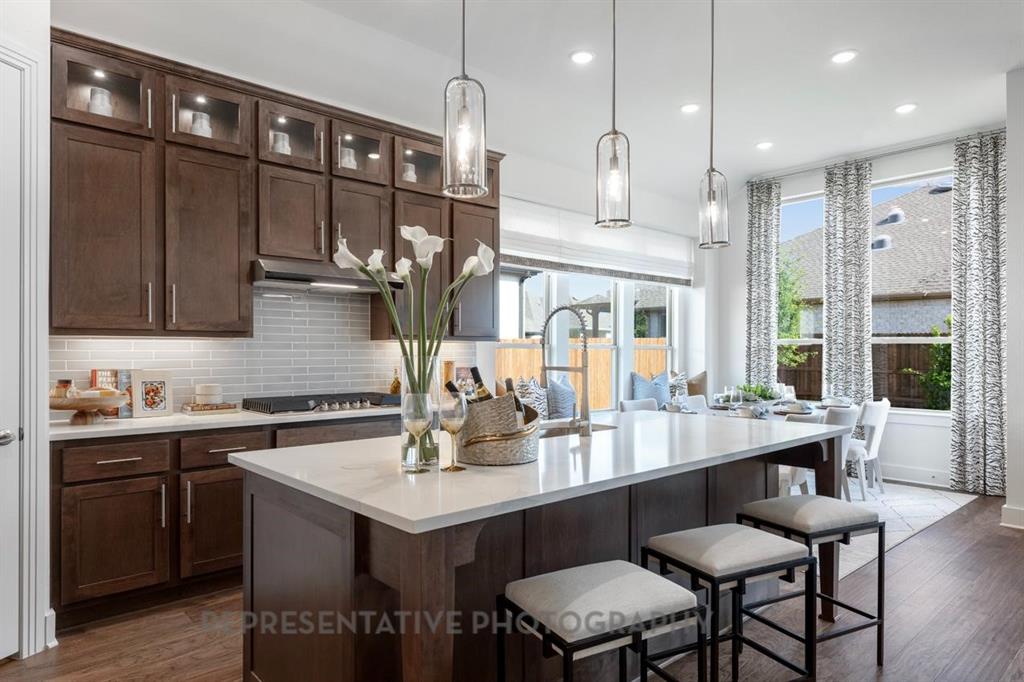 1609 Quartz Street Northlake, TX 76247 - Photo 5 of 40 a kitchen with a sink and cabinets