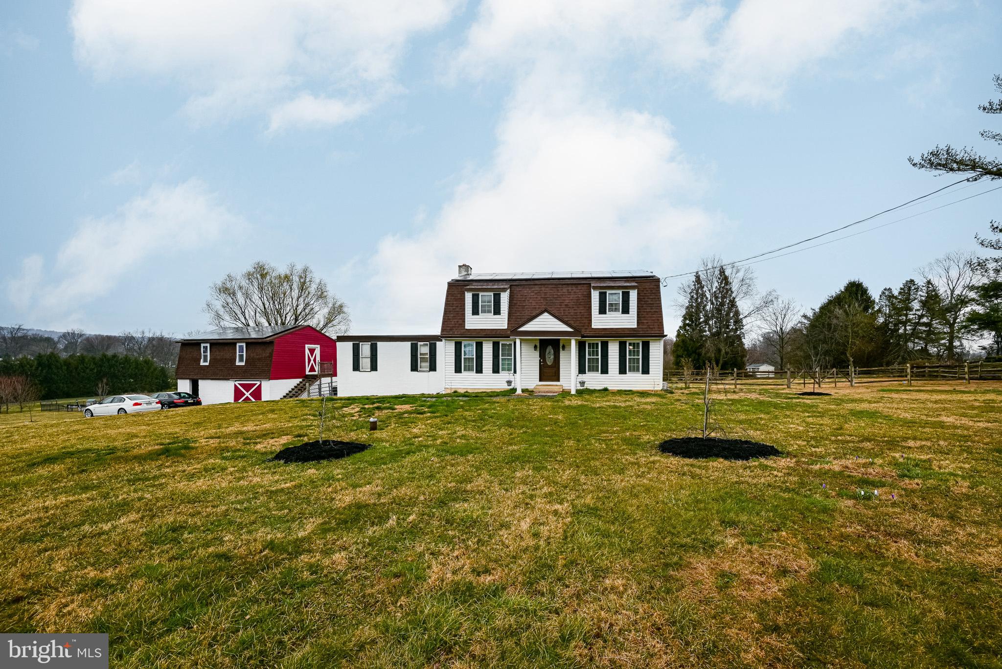 172 Morgantown Road Honey Brook, PA 19344 - Photo 1 of 29 a backyard of a house with table and chairs