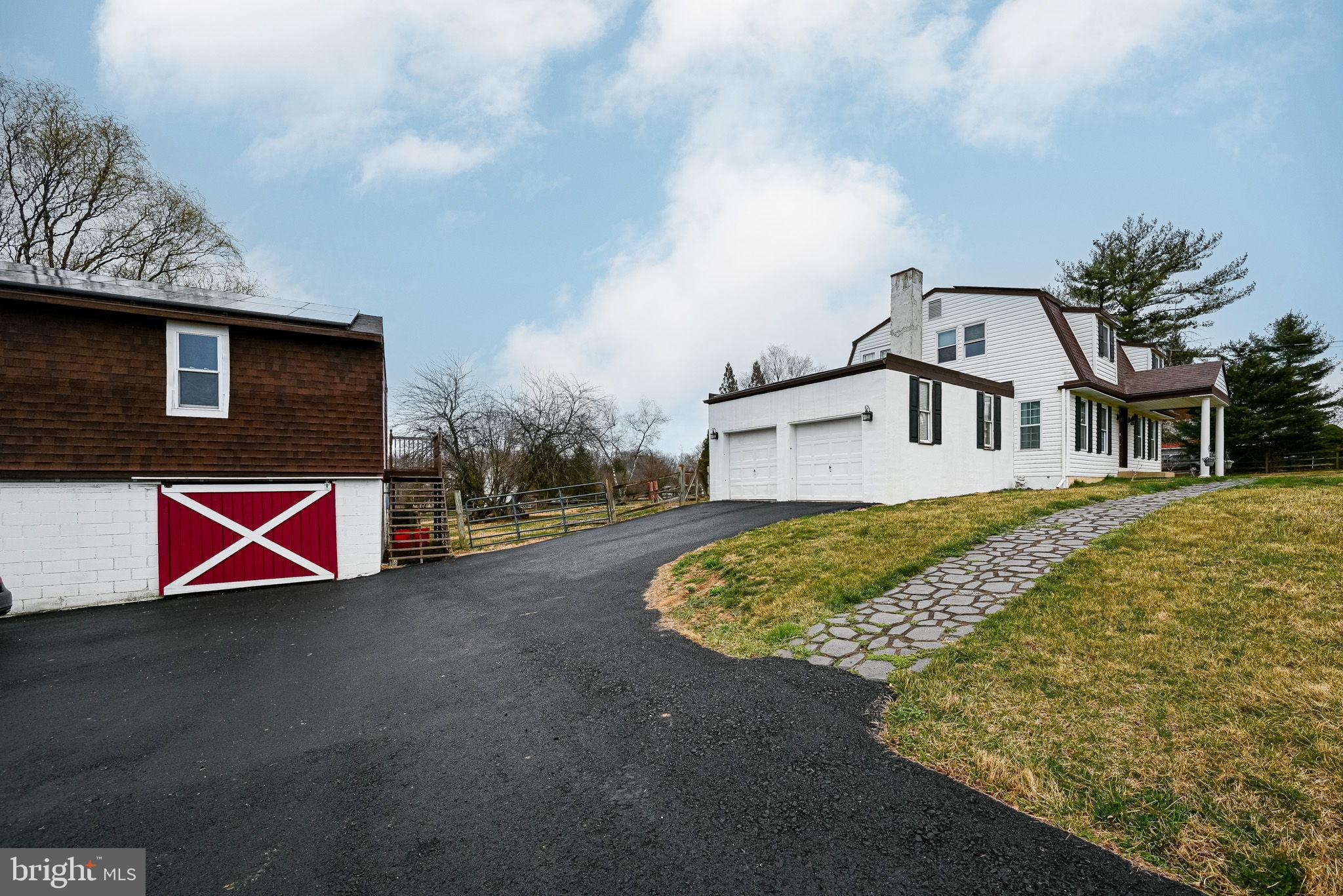 172 Morgantown Road Honey Brook, PA 19344 - Photo 2 of 29 a front view of a house with a yard