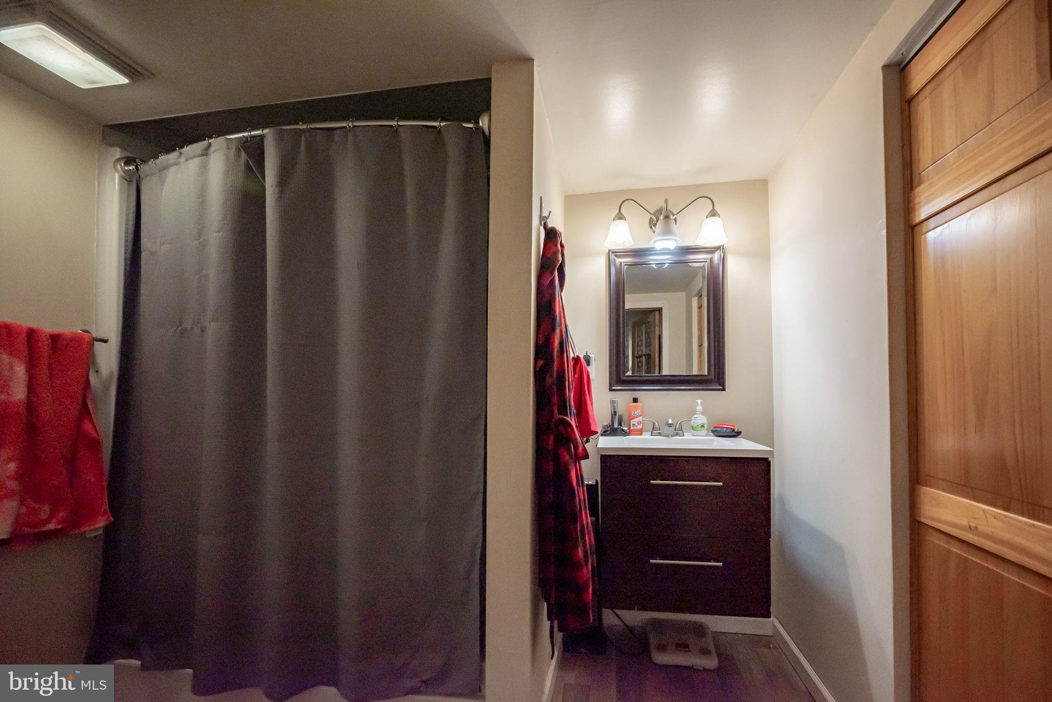 172 Morgantown Road Honey Brook, PA 19344 - Photo 20 of 29 a bathroom with a double vanity sink and mirror