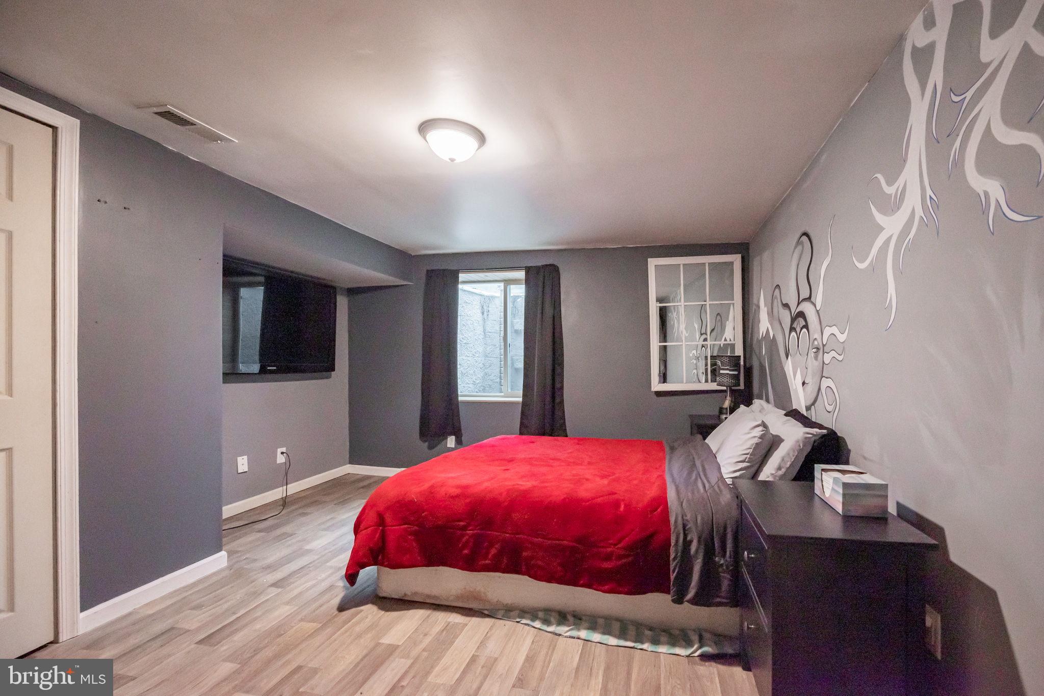 172 Morgantown Road Honey Brook, PA 19344 - Photo 21 of 29 a bedroom with a bed and wooden floor