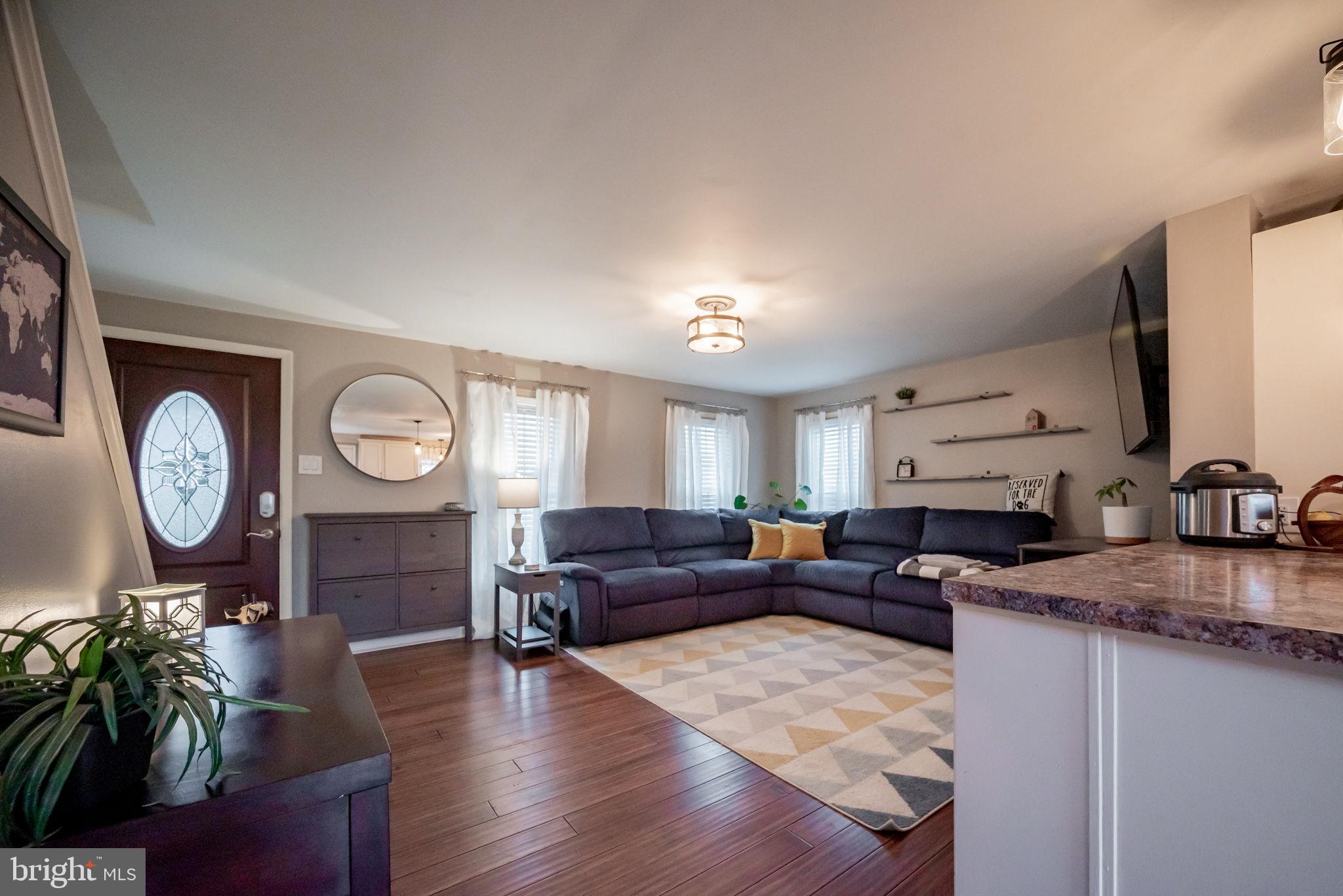 172 Morgantown Road Honey Brook, PA 19344 - Photo 29 of 29 a living room with furniture a large window and wooden floor