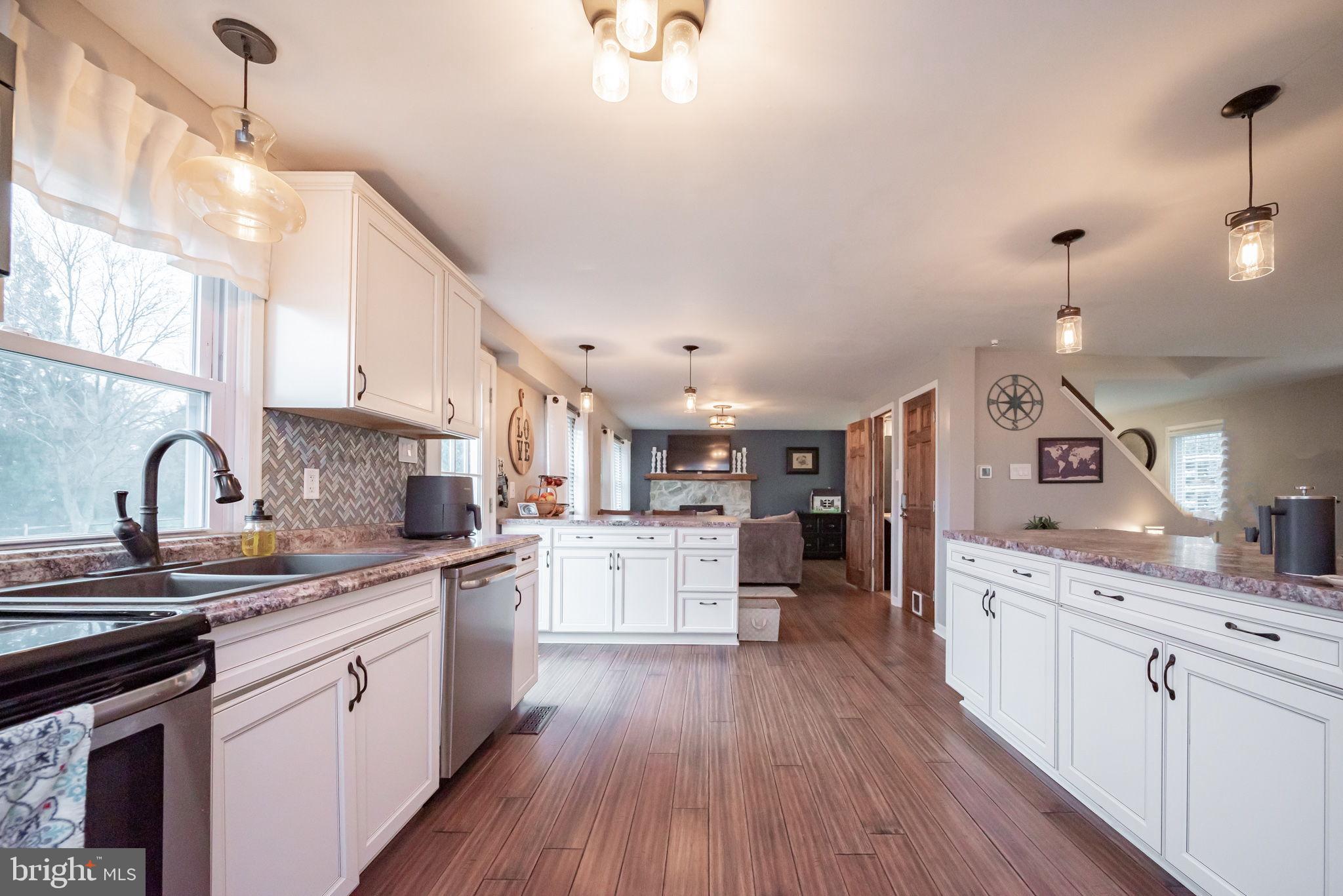 172 Morgantown Road Honey Brook, PA 19344 - Photo 6 of 29 a kitchen with a sink cabinets and wooden floor