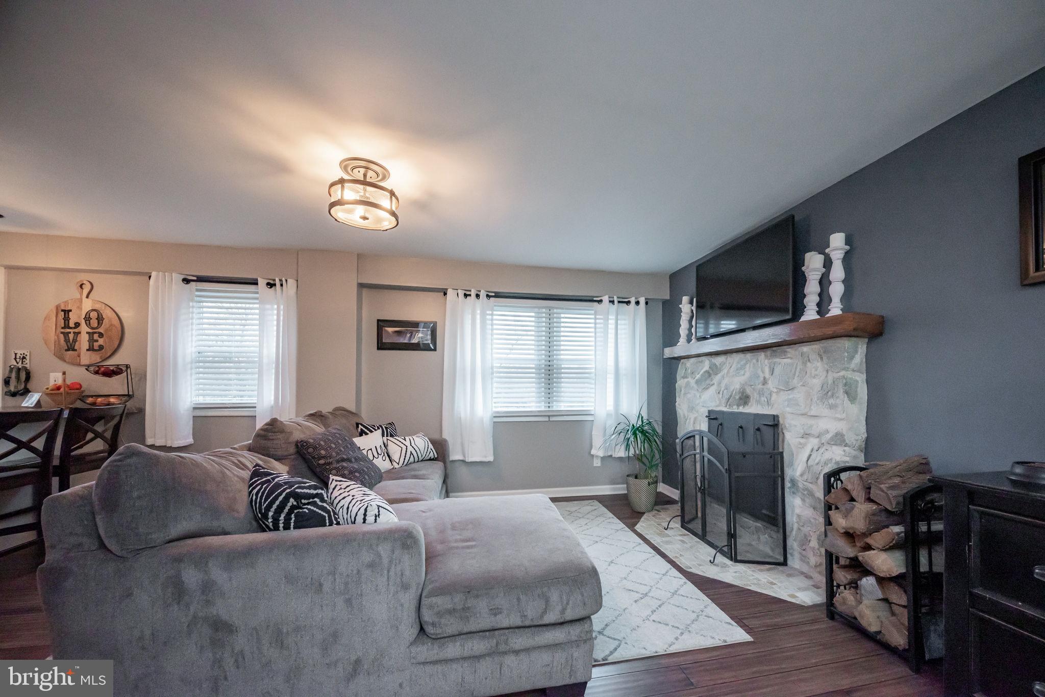 172 Morgantown Road Honey Brook, PA 19344 - Photo 7 of 29 a living room with furniture fireplace and window
